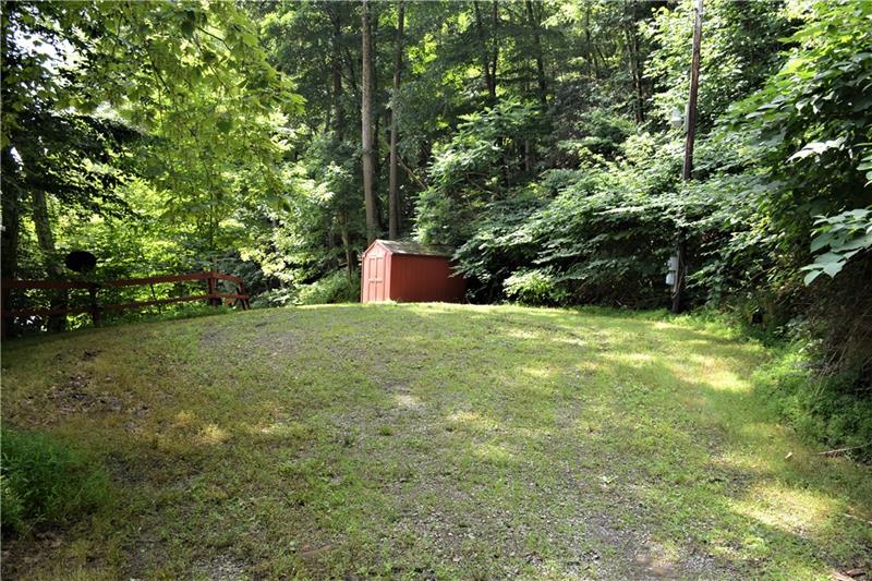 312 Hemlock Road Kennerdell, PA 16374 - Photo 1 of 11 Large level area for the building of a home. Beyond the shed is boat access to the river.