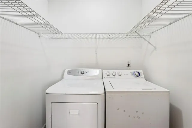 a utility room with dryer and washer