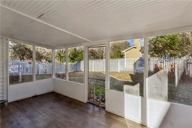 a living room with furniture and windows