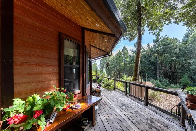 a view of a balcony with flower plants