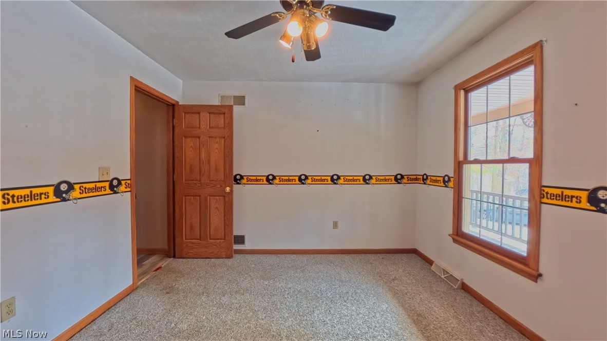 48276 Dyke Road Negley, OH 44441 - Photo 21 of 30 Spare room with light colored carpet and a ceiling fan