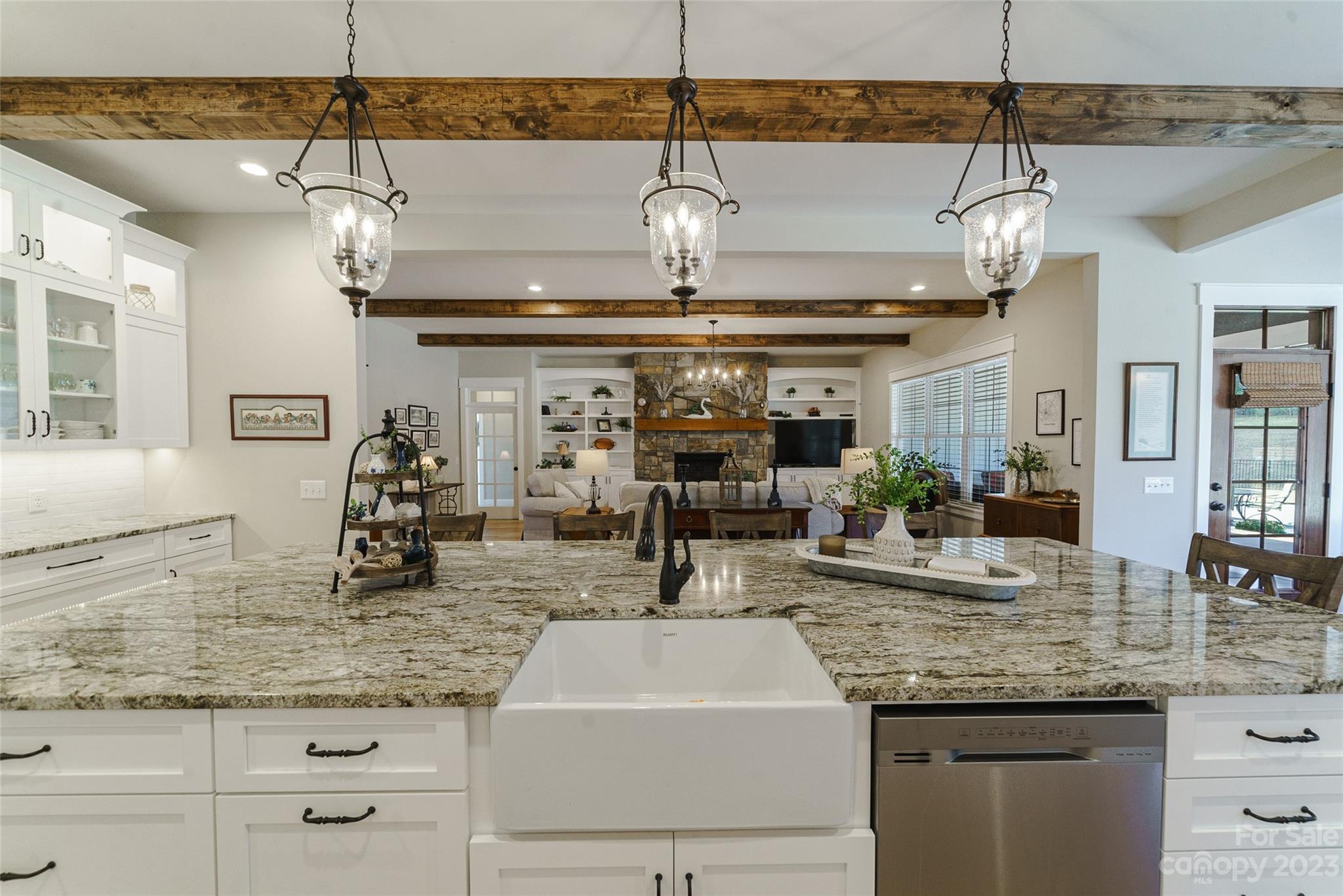 16063 McLester Road Oakboro, NC 28129 - Photo 16 of 48 a kitchen with center island and chandelier