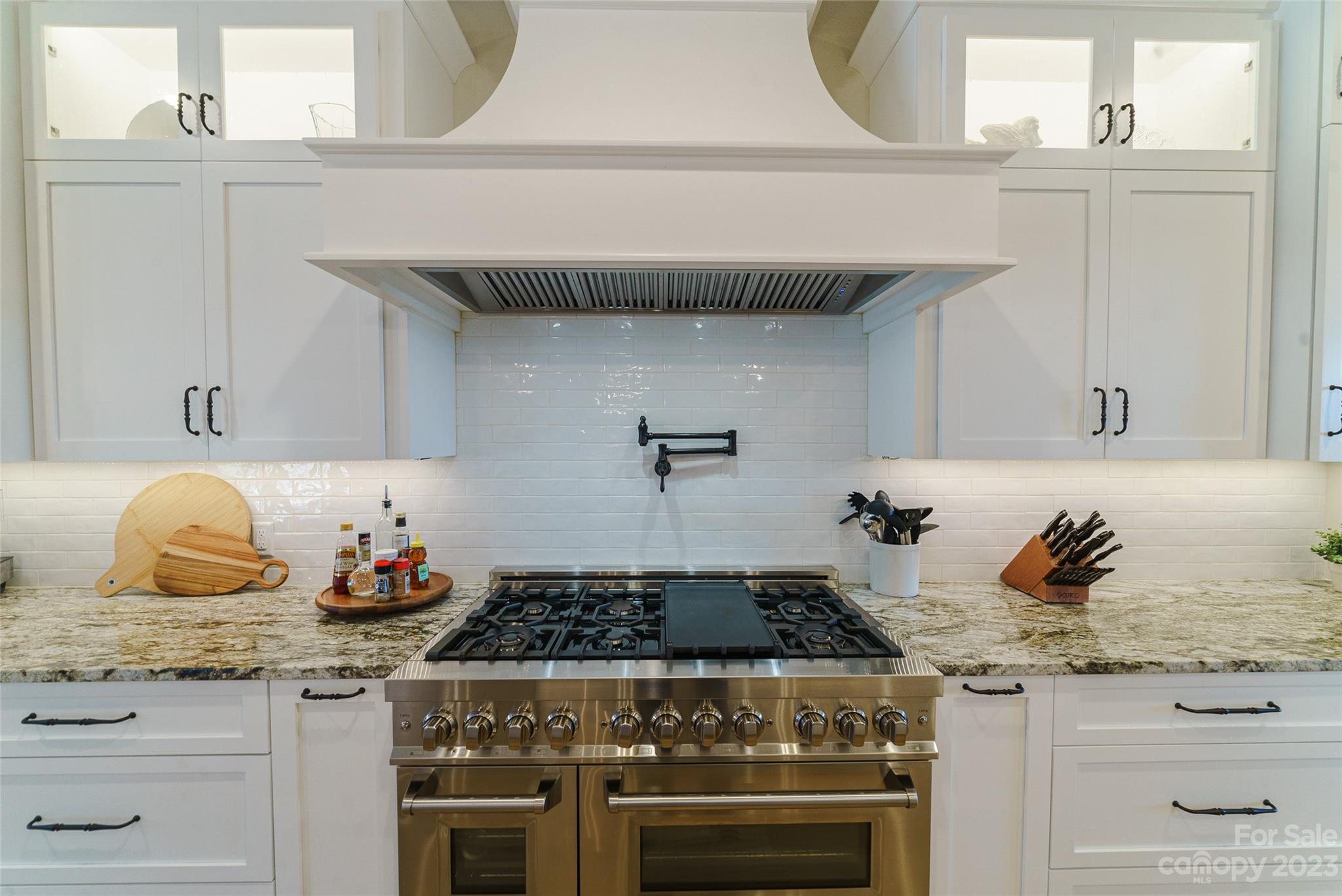 16063 McLester Road Oakboro, NC 28129 - Photo 17 of 48 a kitchen with a stove and cabinets