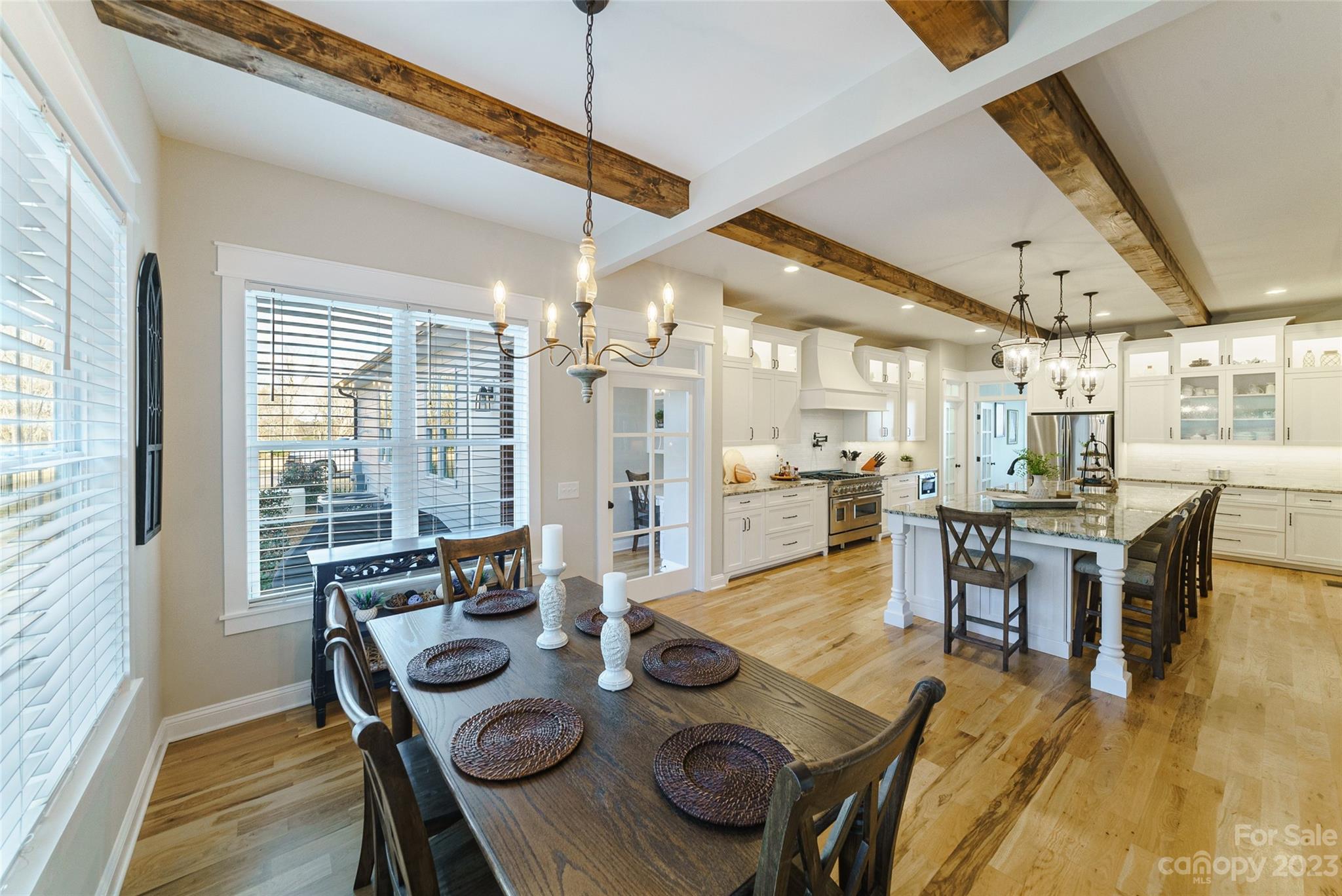 16063 McLester Road Oakboro, NC 28129 - Photo 18 of 48 a dinning room and kitchen with furniture large window and wooden floor