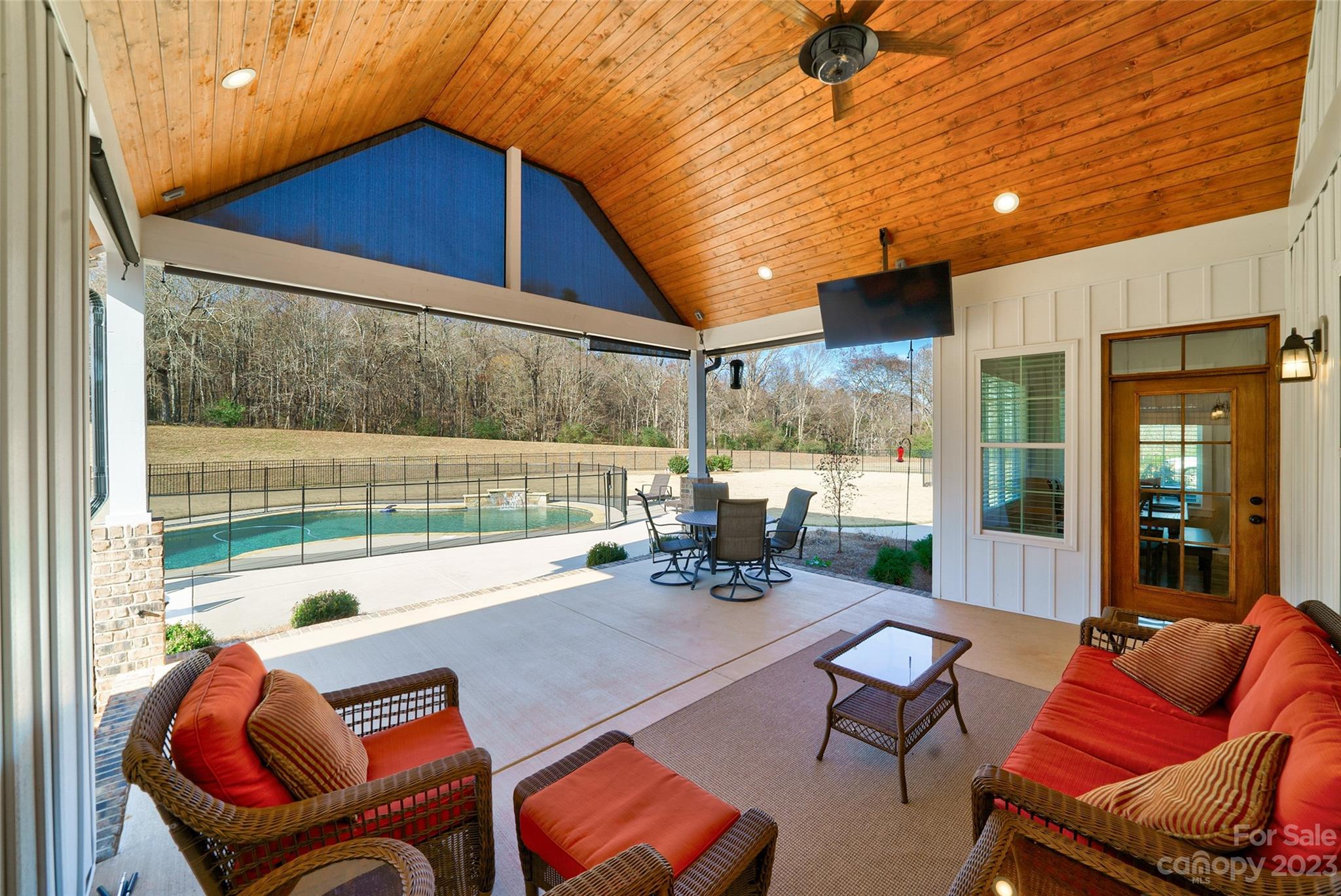16063 McLester Road Oakboro, NC 28129 - Photo 20 of 48 a backyard of a house with outdoor seating