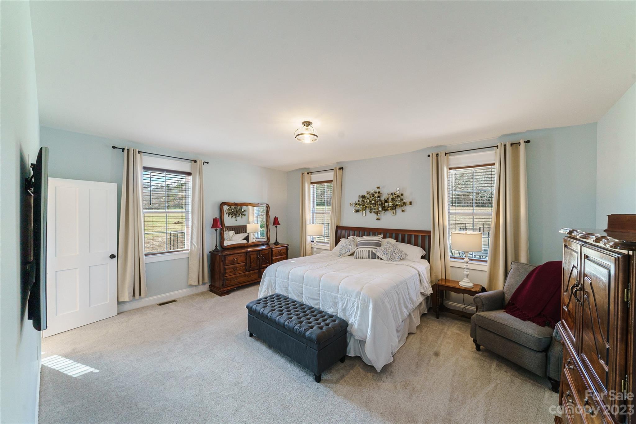 16063 McLester Road Oakboro, NC 28129 - Photo 22 of 48 a bedroom with a bed and a couch