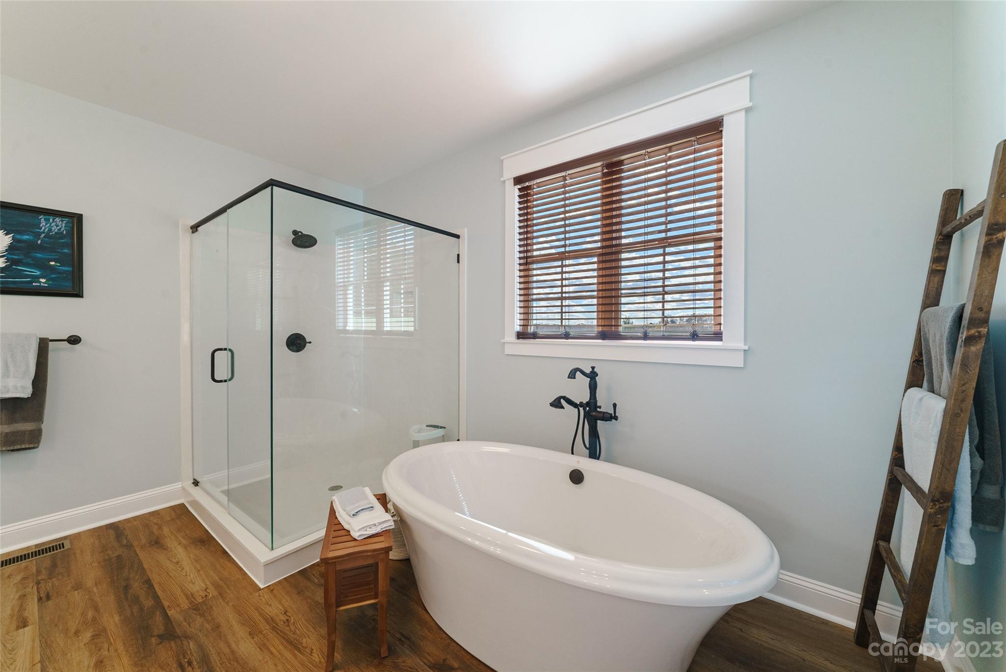 16063 McLester Road Oakboro, NC 28129 - Photo 24 of 48 a white bath tub sitting next to a small bathroom