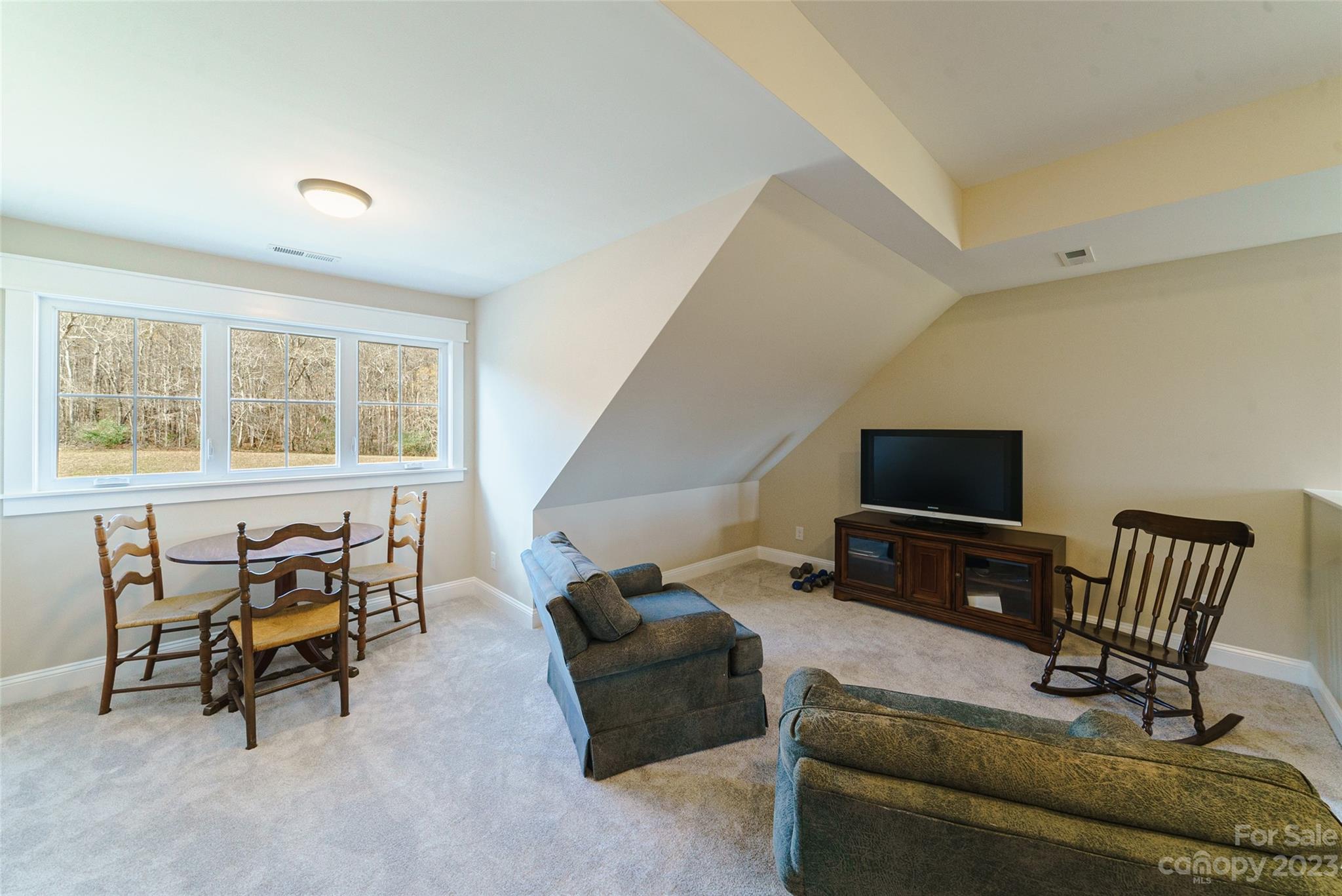 16063 McLester Road Oakboro, NC 28129 - Photo 35 of 48 a living room with furniture and a flat screen tv
