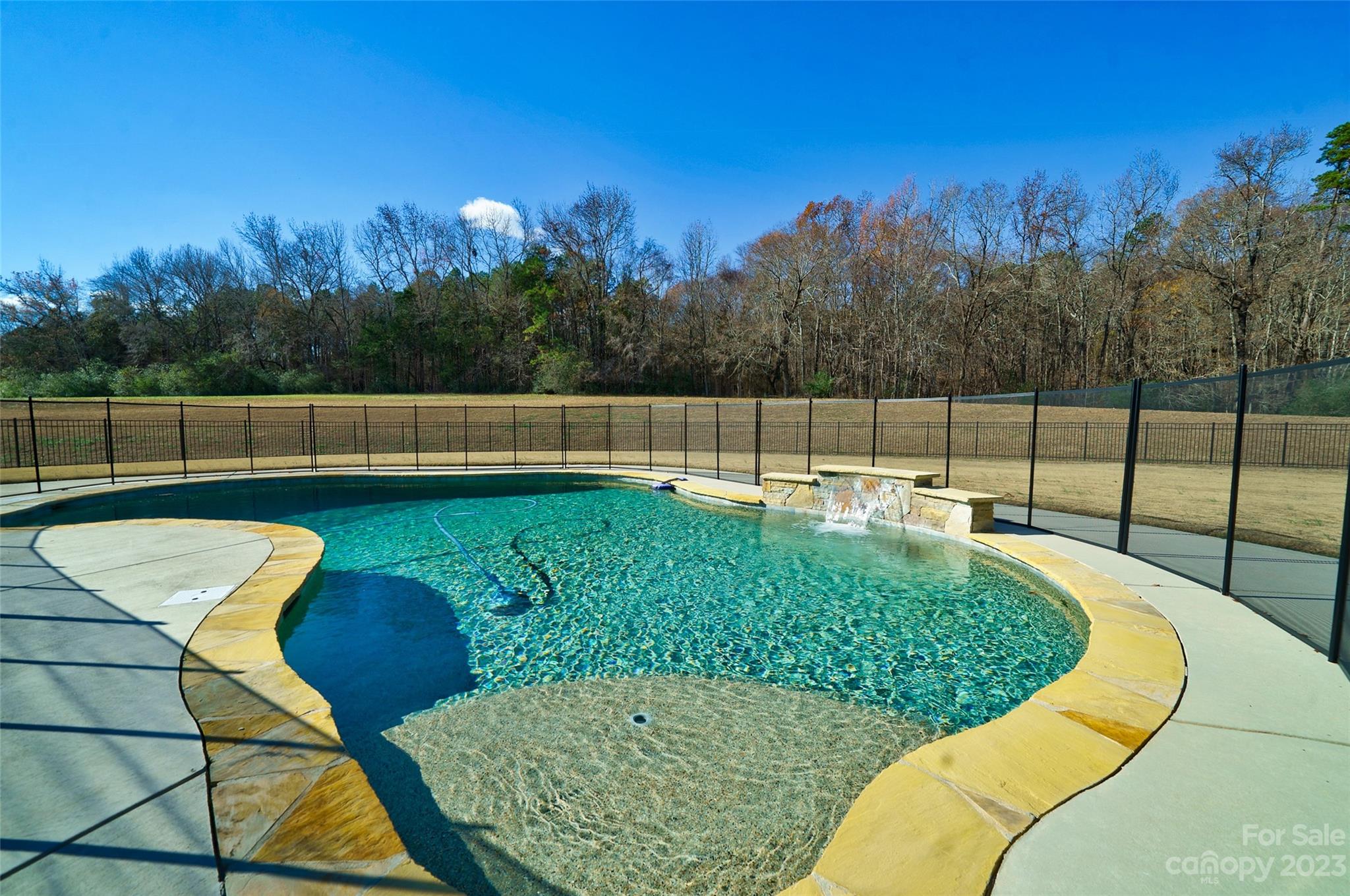 16063 McLester Road Oakboro, NC 28129 - Photo 41 of 48 a view of a swimming pool with a seating space