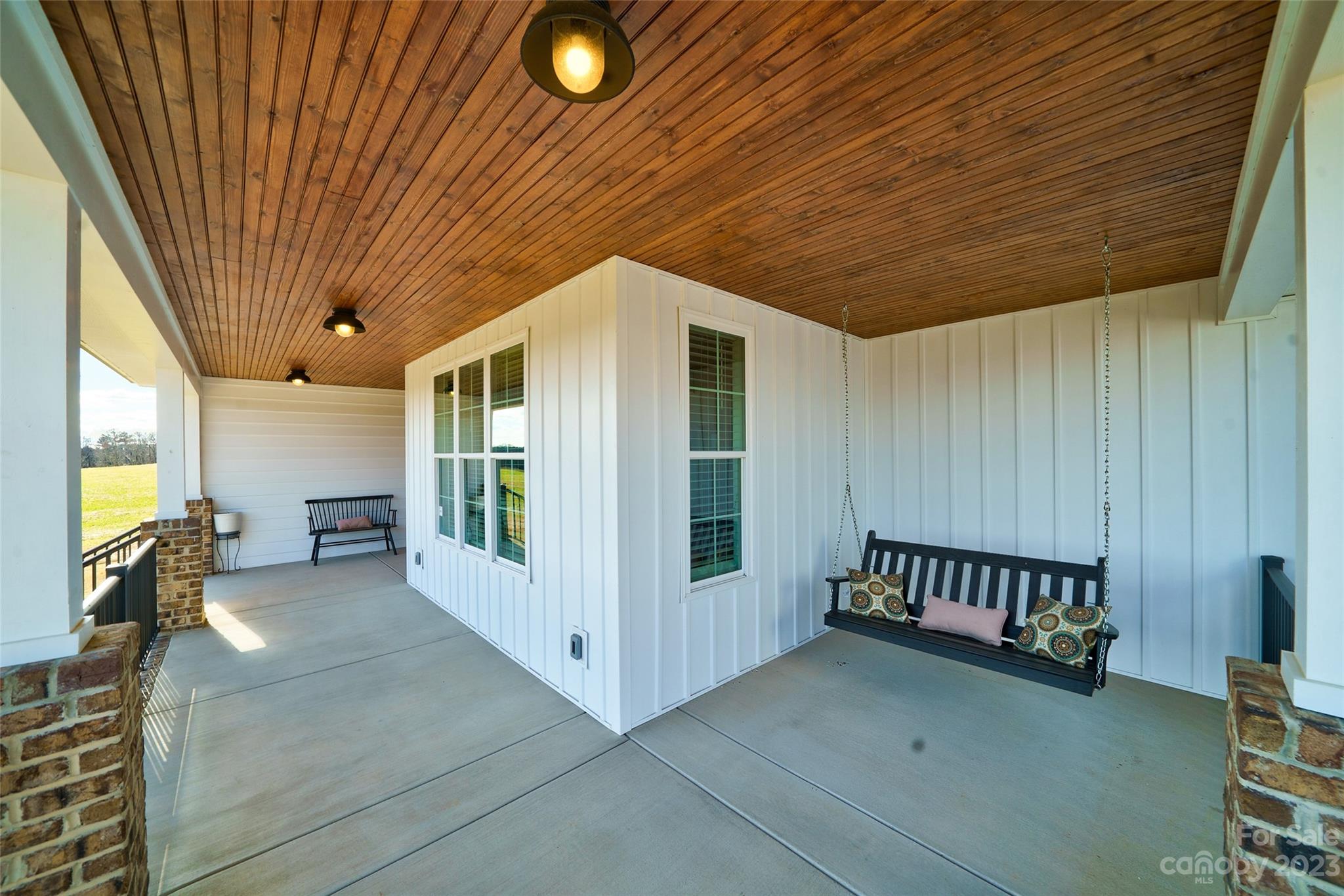 16063 McLester Road Oakboro, NC 28129 - Photo 42 of 48 a view of a porch with furniture and front door