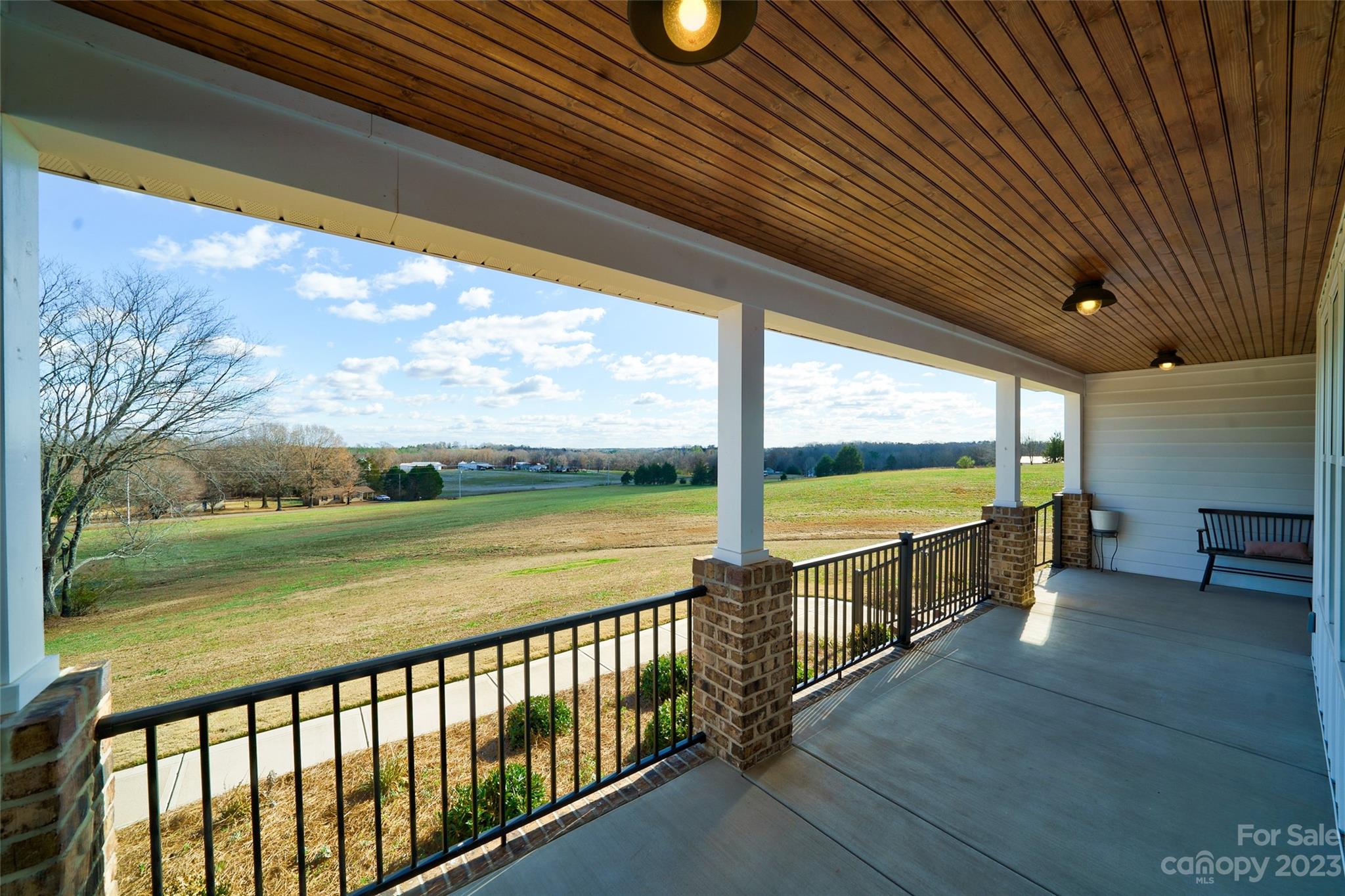16063 McLester Road Oakboro, NC 28129 - Photo 5 of 48 a view of a porch with furniture and garden