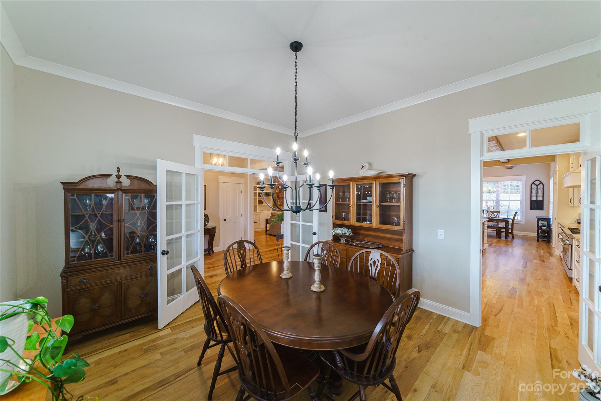 16063 McLester Road Oakboro, NC 28129 - Photo 8 of 48 a view of a dining room with furniture wooden floor and chandelier