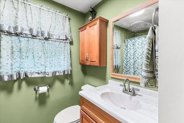 a front view of a house with yard and outdoor seating