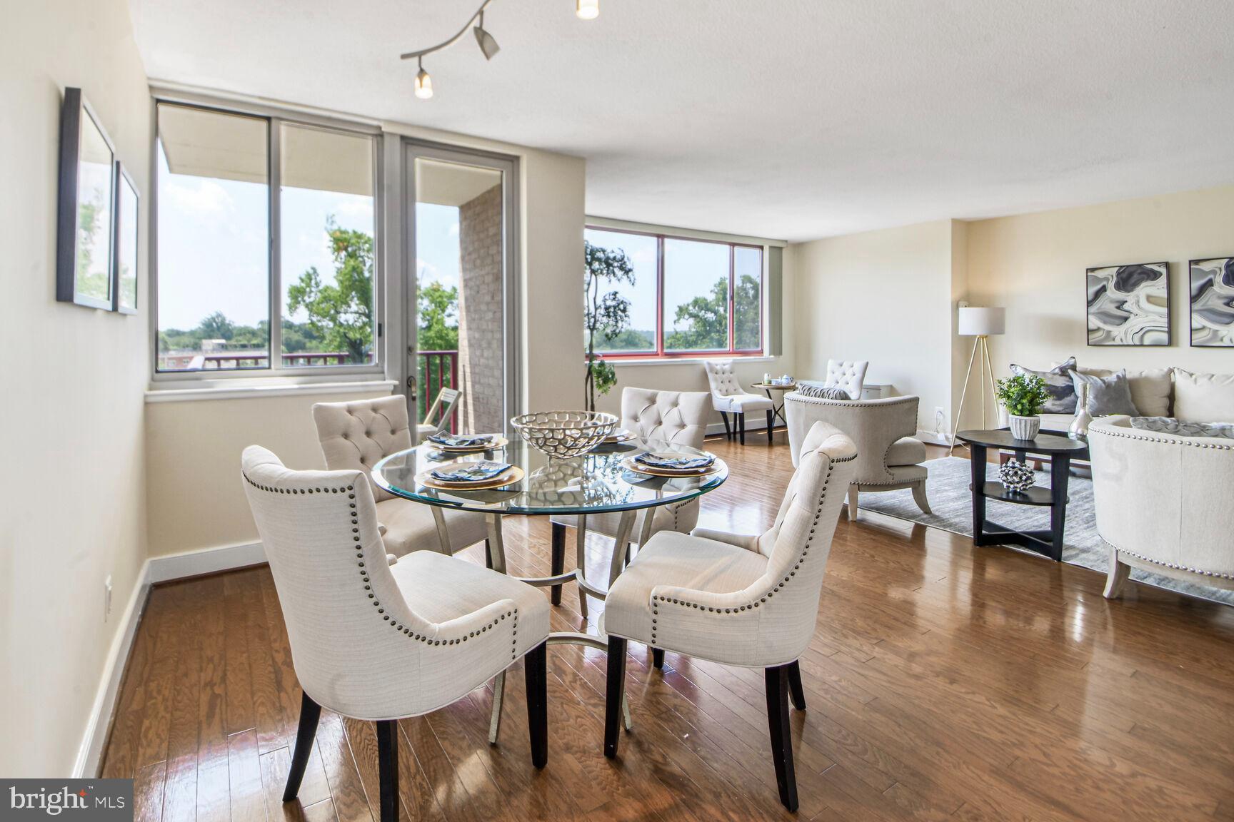 1220 Blair Mill Road, Unit 605 Silver Spring, MD 20910 - Photo 15 of 46 a view of a dining room with furniture window and wooden floor
