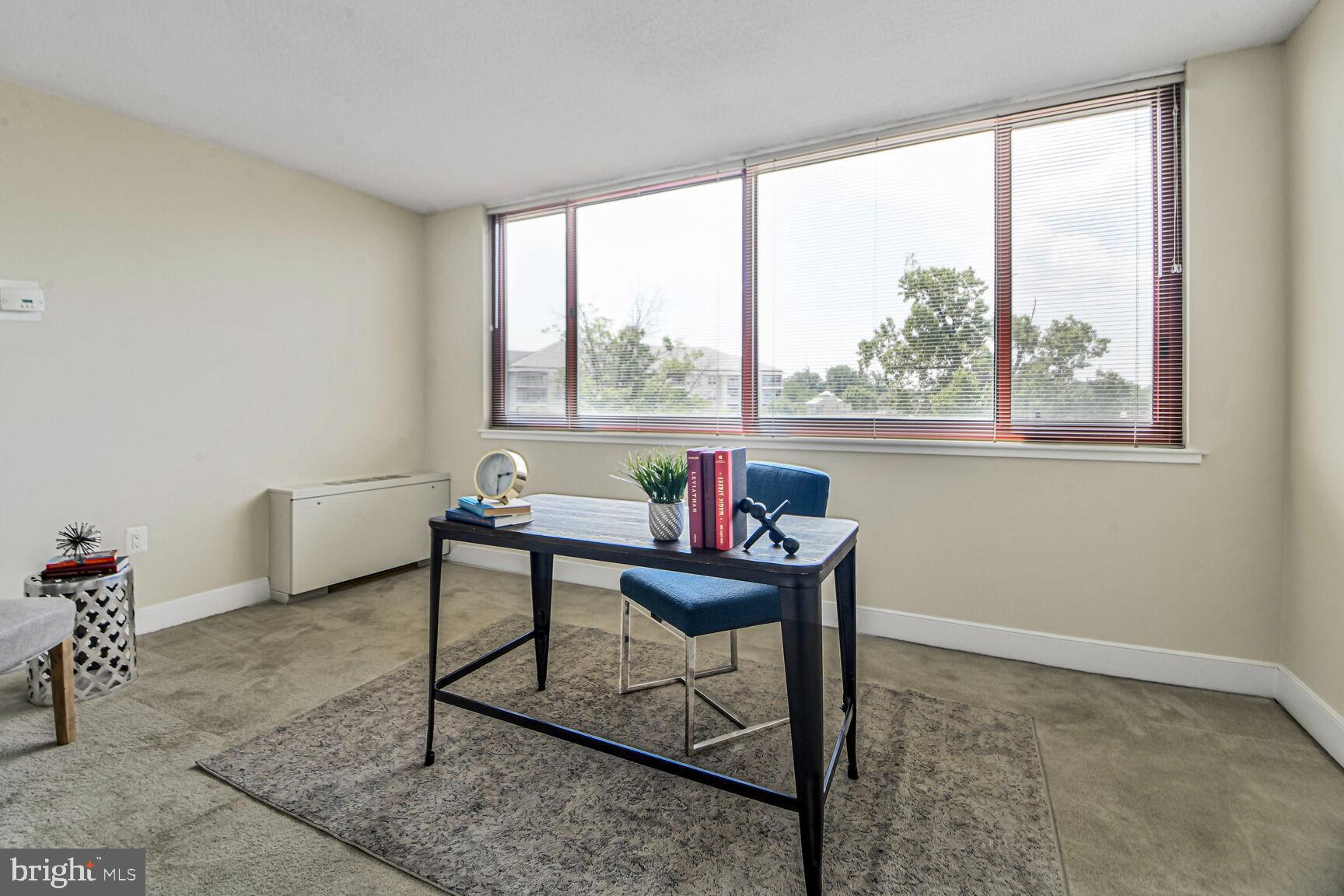 1220 Blair Mill Road, Unit 605 Silver Spring, MD 20910 - Photo 25 of 46 a living room with furniture and a window