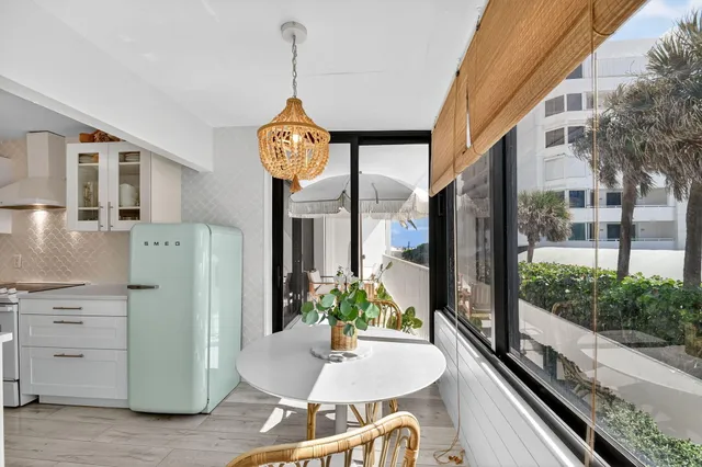 a view of a kitchen with furniture and a chandelier