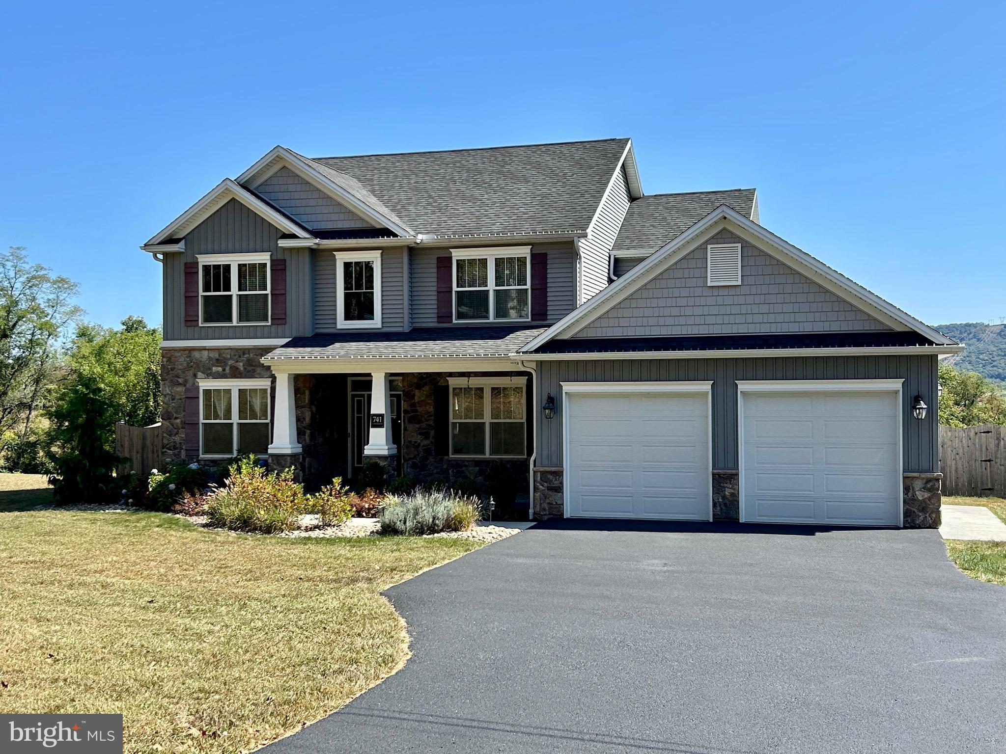 741 South River Road Halifax, PA 17032 - Photo 3 of 117 a front view of a house with a yard and garage