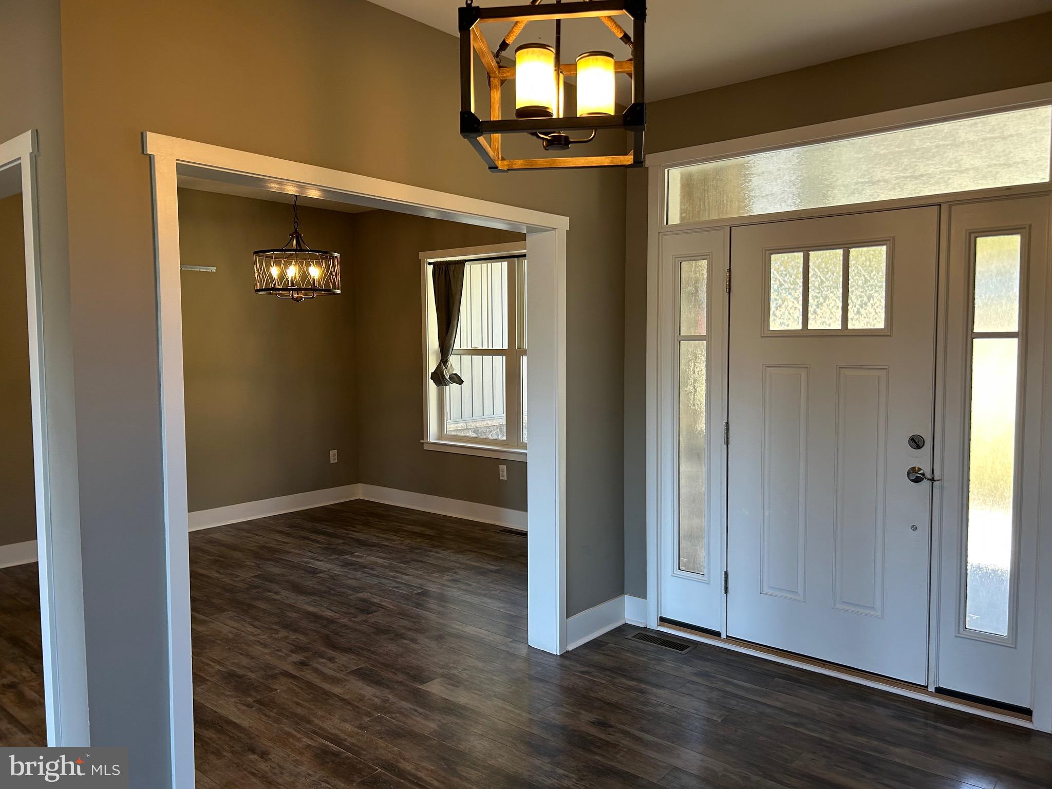 741 South River Road Halifax, PA 17032 - Photo 31 of 117 an empty room with wooden floor and windows