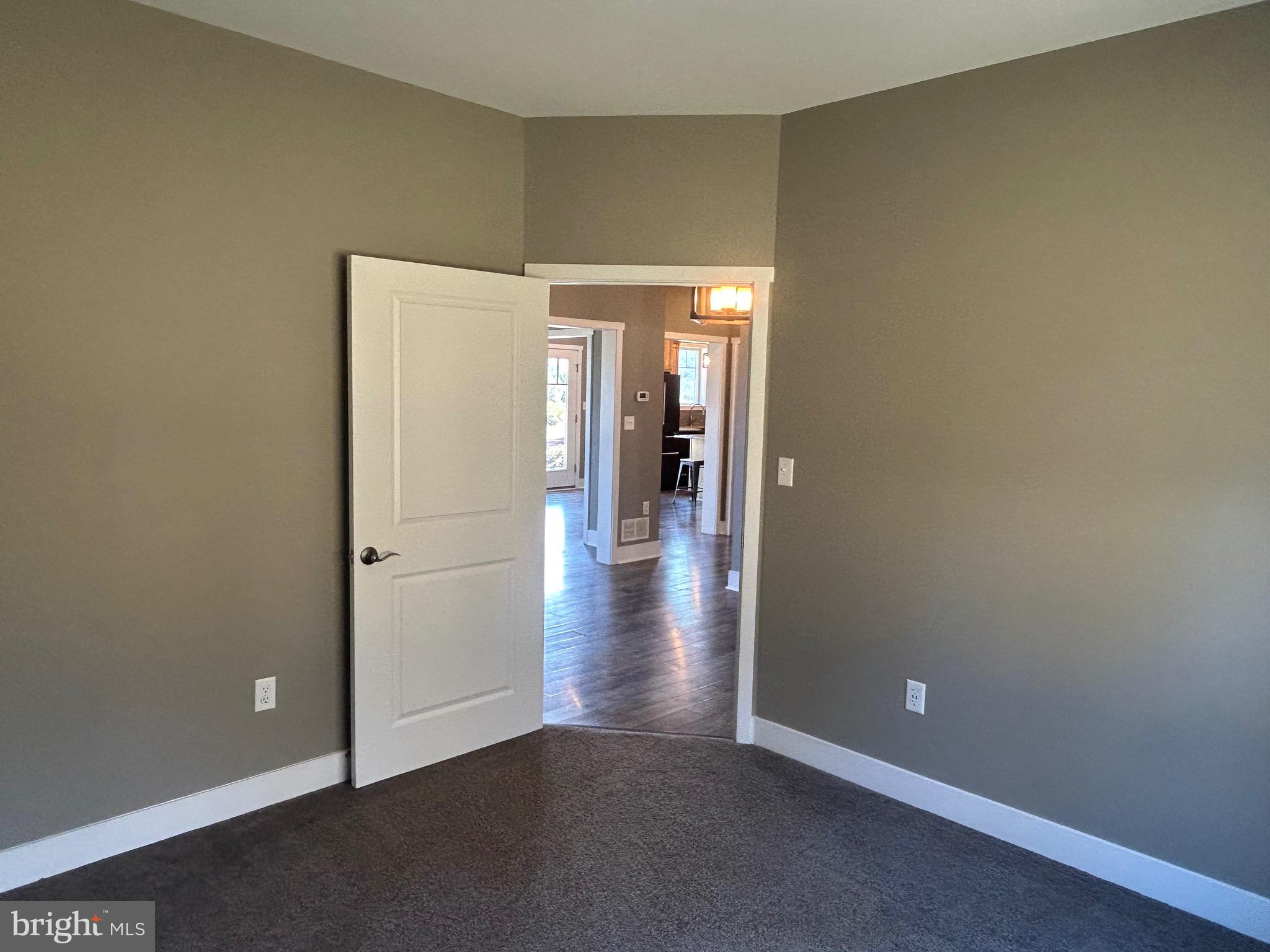 741 South River Road Halifax, PA 17032 - Photo 35 of 117 an empty room with wooden floor and entrance