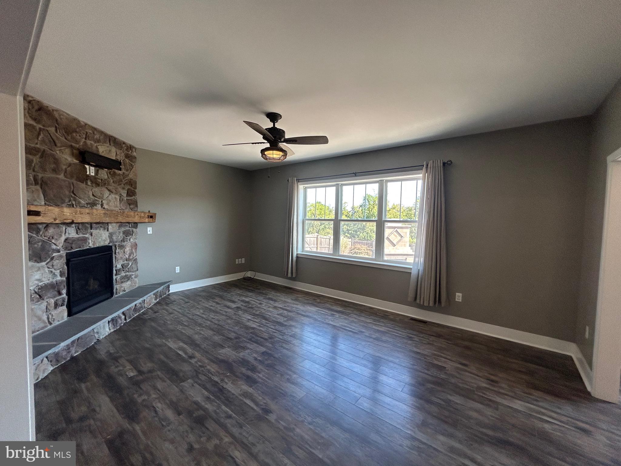 741 South River Road Halifax, PA 17032 - Photo 38 of 117 a view of an empty room with a fireplace and a window