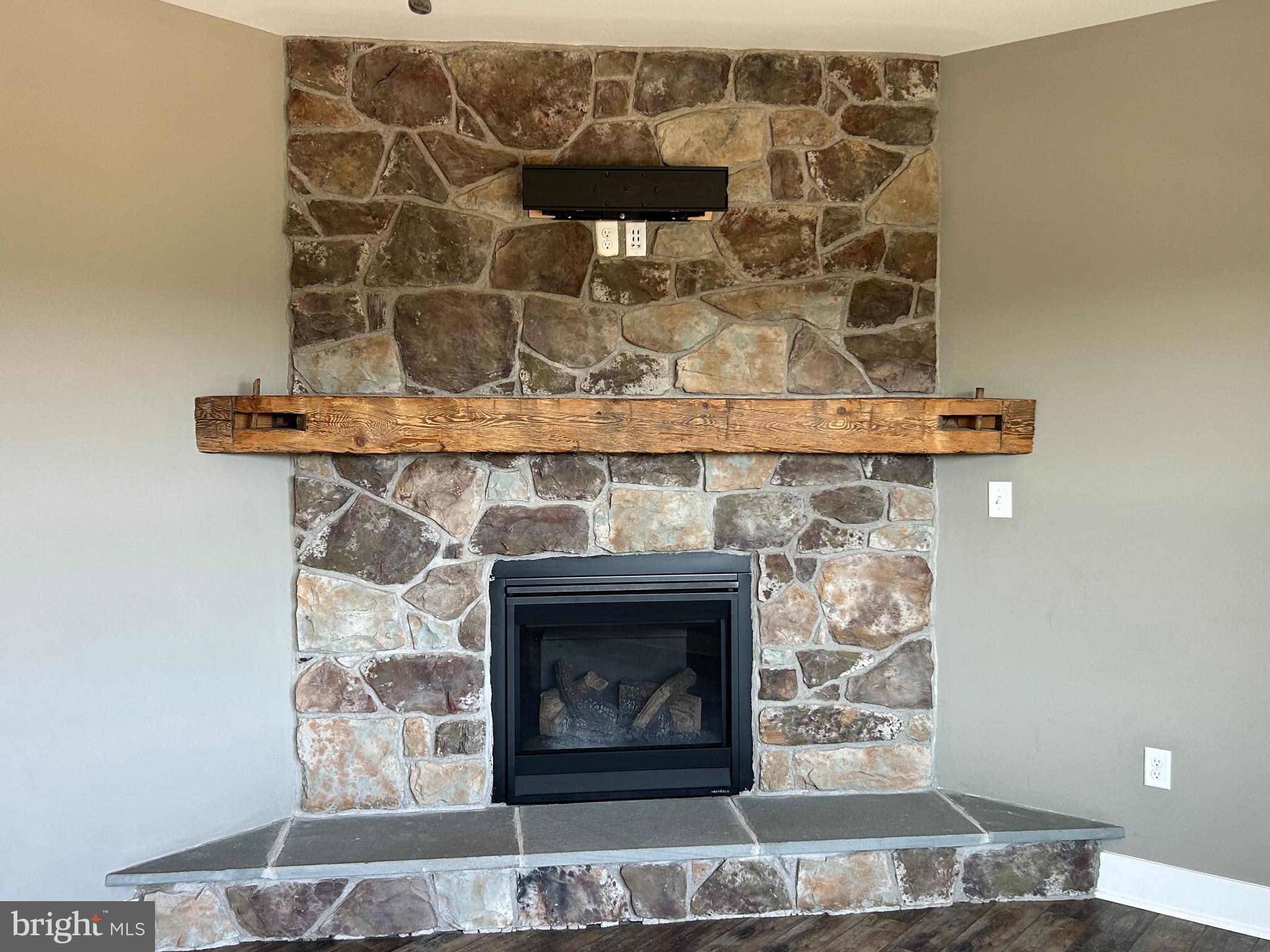 741 South River Road Halifax, PA 17032 - Photo 41 of 117 a fireplace with a clock on top of it