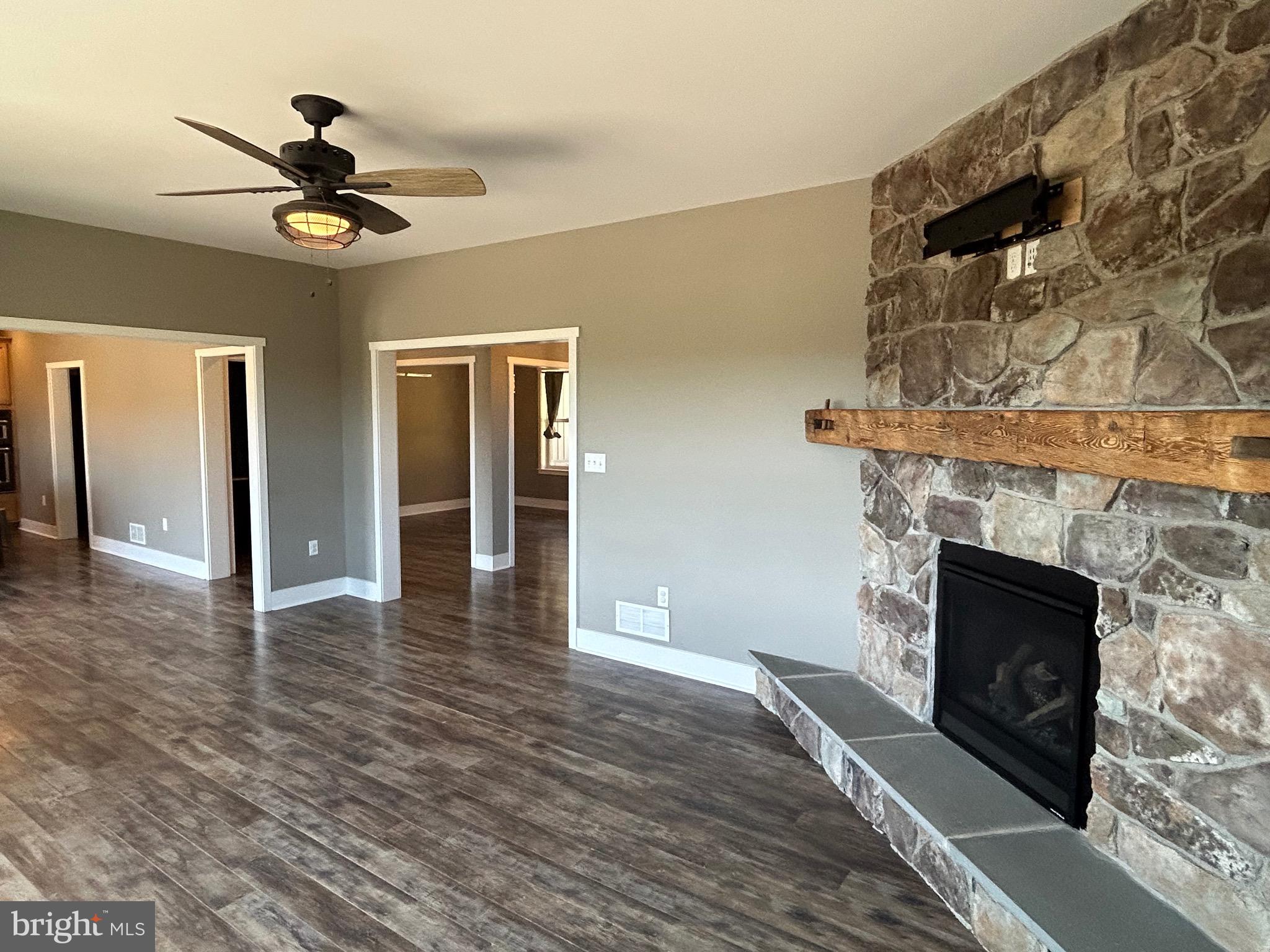 741 South River Road Halifax, PA 17032 - Photo 42 of 117 a view of an empty room with wooden floor a fireplace and a window