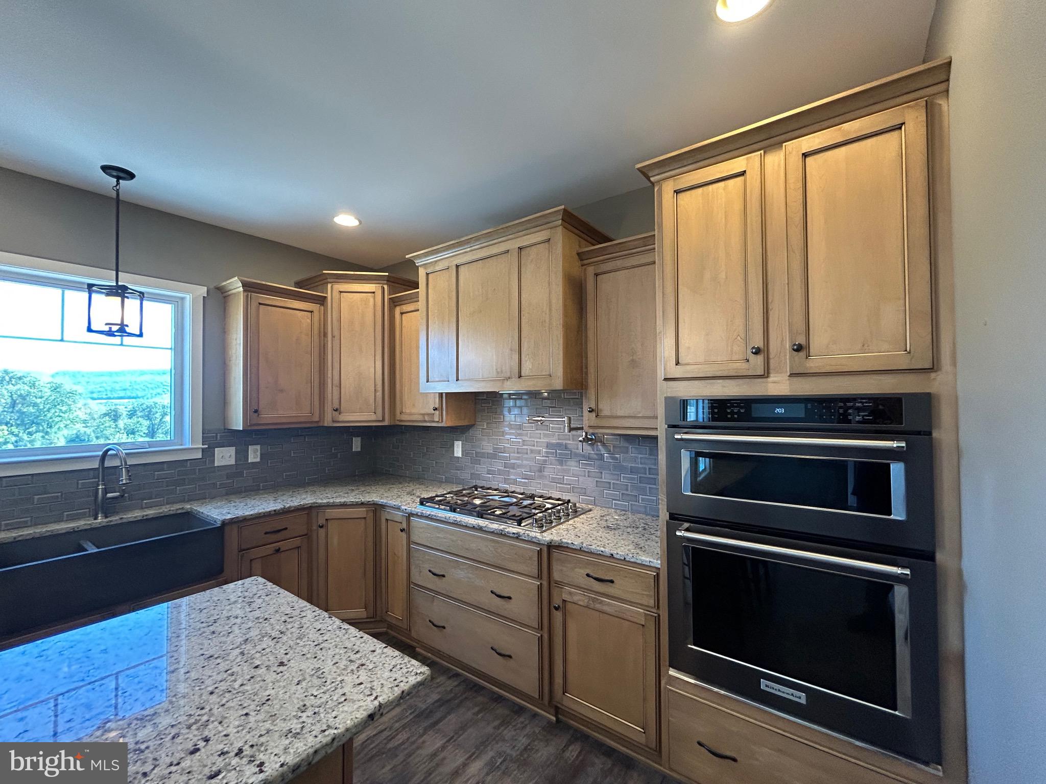 741 South River Road Halifax, PA 17032 - Photo 50 of 117 a kitchen with stainless steel appliances granite countertop a stove a sink and a microwave