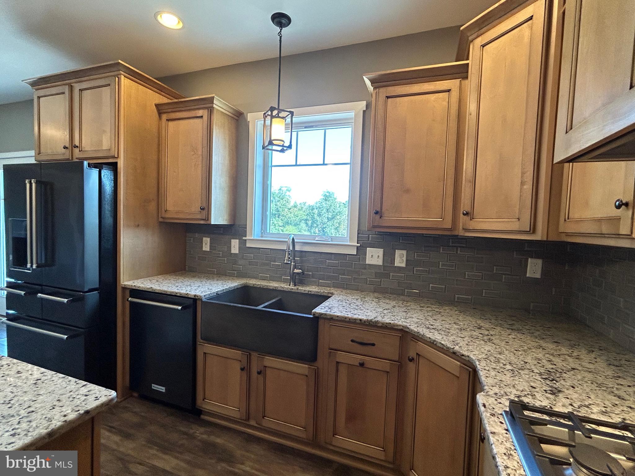 741 South River Road Halifax, PA 17032 - Photo 51 of 117 a kitchen with stainless steel appliances granite countertop a sink a stove a refrigerator and cabinets