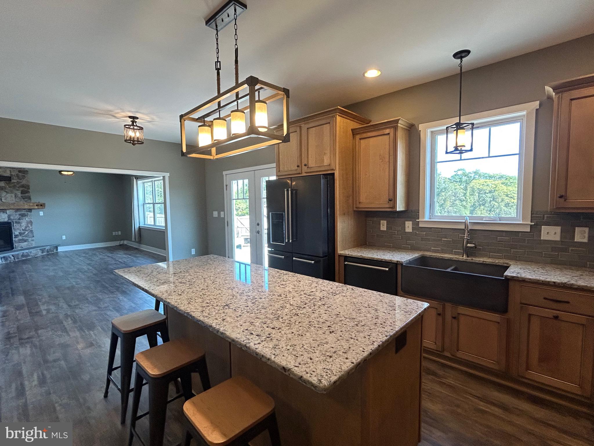 741 South River Road Halifax, PA 17032 - Photo 54 of 117 a kitchen with granite countertop kitchen island a table and chairs in it