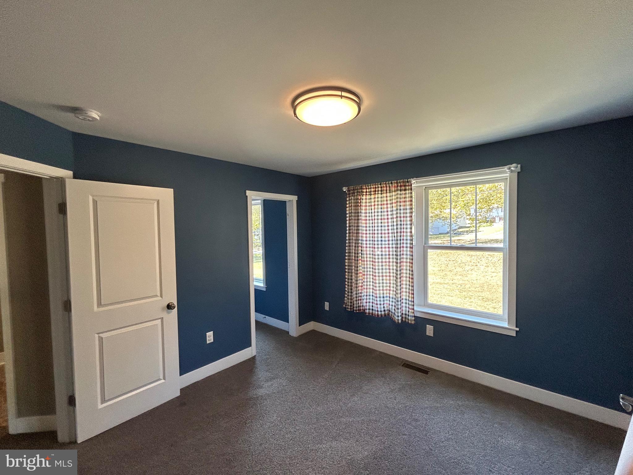741 South River Road Halifax, PA 17032 - Photo 66 of 117 a view of an empty room with a window and a kitchen