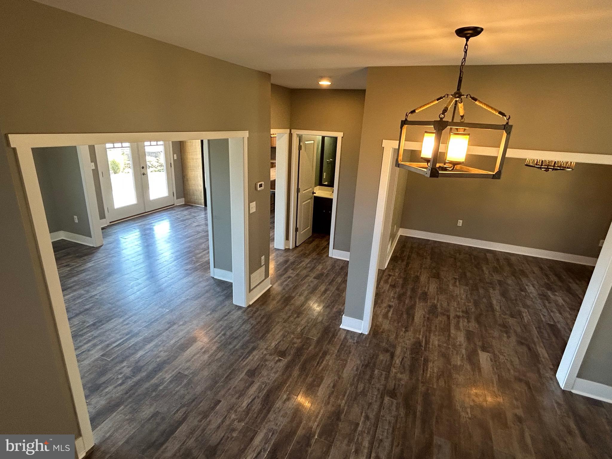 741 South River Road Halifax, PA 17032 - Photo 91 of 117 a view of a room with wooden floor staircase and a kitchen