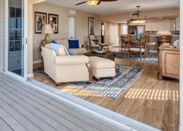 a bedroom with a bed a dresser and flat screen tv