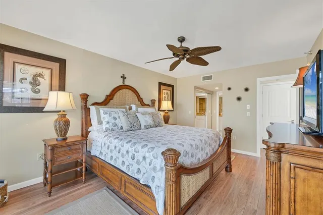 a bathroom with a granite countertop sink a mirror and a shower
