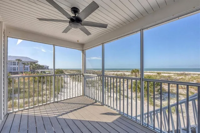 an aerial view of a house with a big yard and large trees