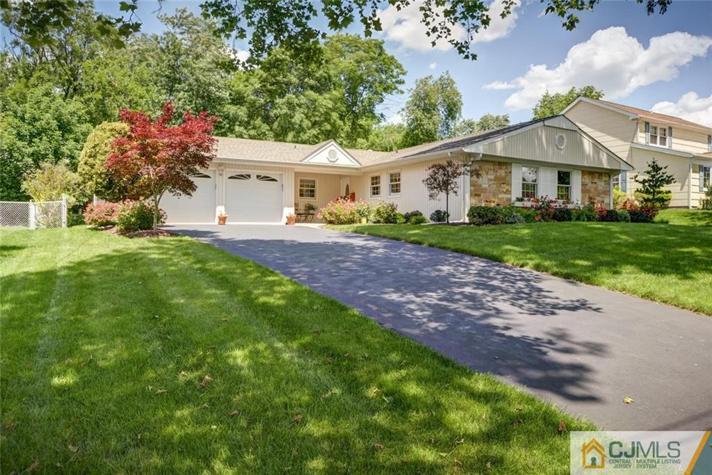 25 Indiana Road Somerset, NJ 08873 - Photo 1 of 25 a front view of a house with garden