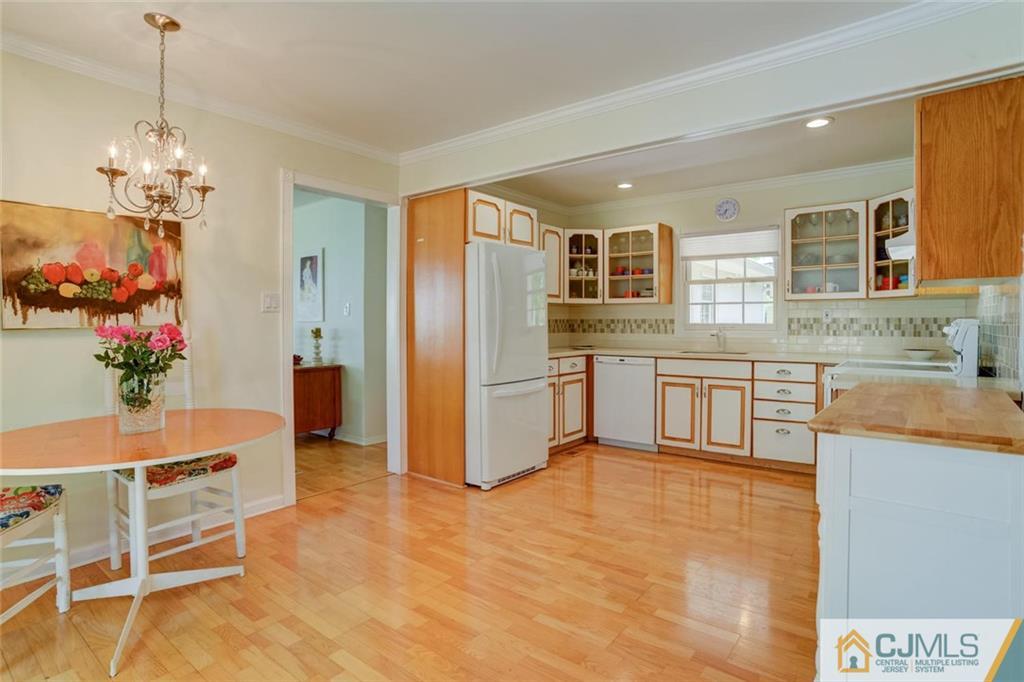 25 Indiana Road Somerset, NJ 08873 - Photo 15 of 25 a kitchen with stainless steel appliances kitchen island granite countertop a refrigerator and a stove top oven