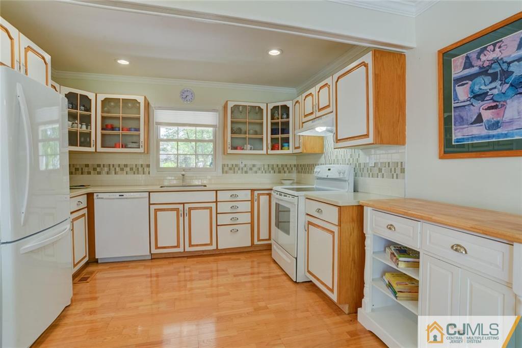 25 Indiana Road Somerset, NJ 08873 - Photo 16 of 25 a kitchen with stainless steel appliances granite countertop a stove and a sink