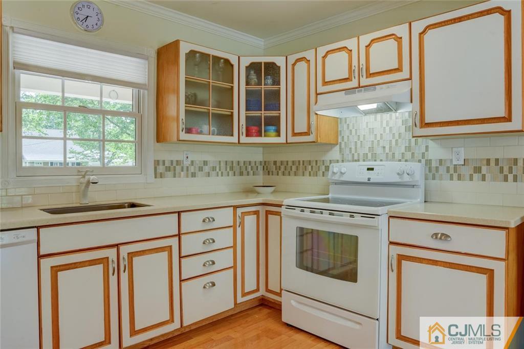 25 Indiana Road Somerset, NJ 08873 - Photo 17 of 25 a kitchen with stainless steel appliances granite countertop a stove and a sink