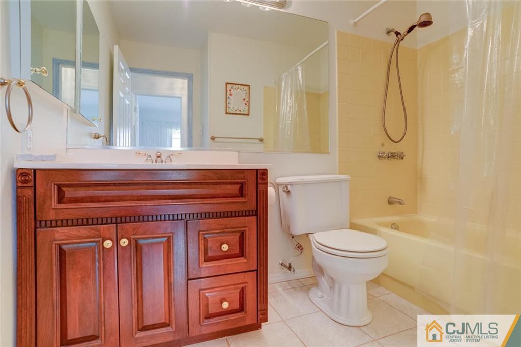 25 Indiana Road Somerset, NJ 08873 - Photo 20 of 25 a bathroom with a granite countertop toilet sink and shower
