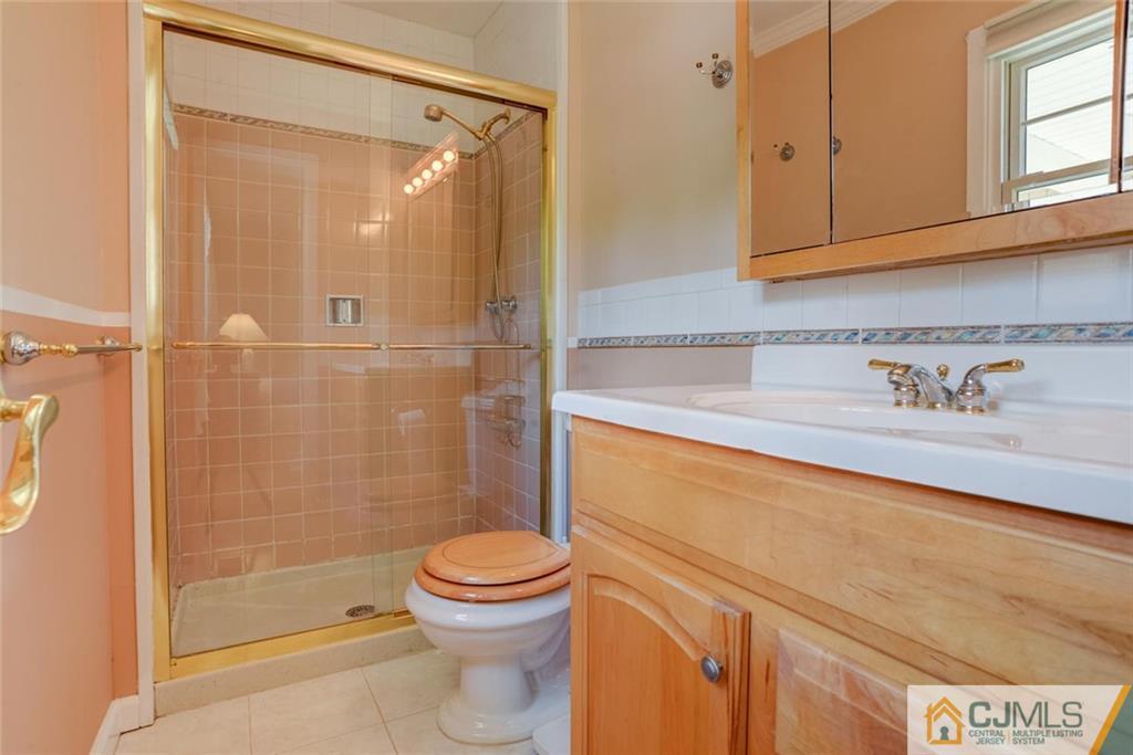 25 Indiana Road Somerset, NJ 08873 - Photo 23 of 25 a bathroom with a sink a toilet and shower