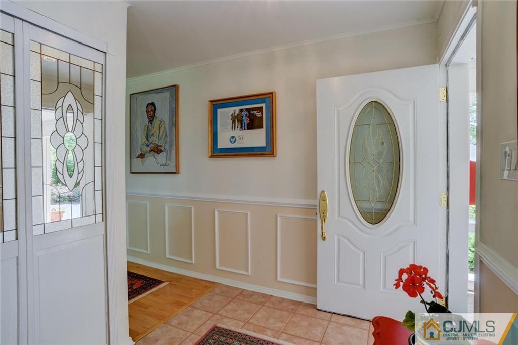 25 Indiana Road Somerset, NJ 08873 - Photo 6 of 25 a view of a hallway with painted walls and a large window