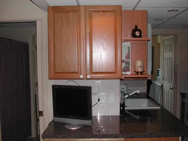 a bathroom with mirror and sink