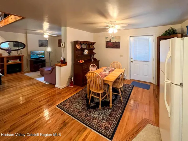 a bedroom with furniture and a rug