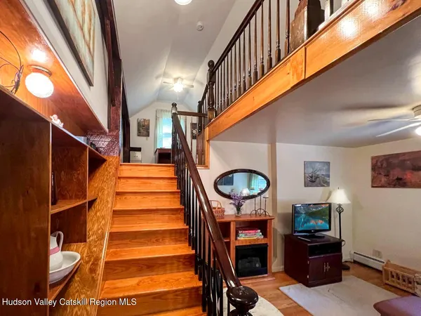 a view of outdoor space with wooden floor and staircase