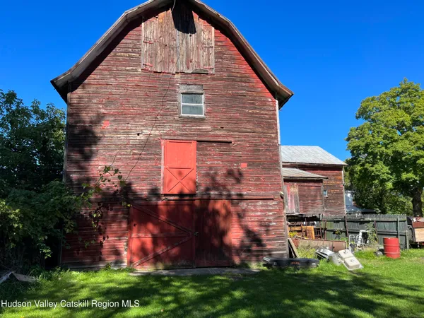 a backyard of a house with a garden and deck