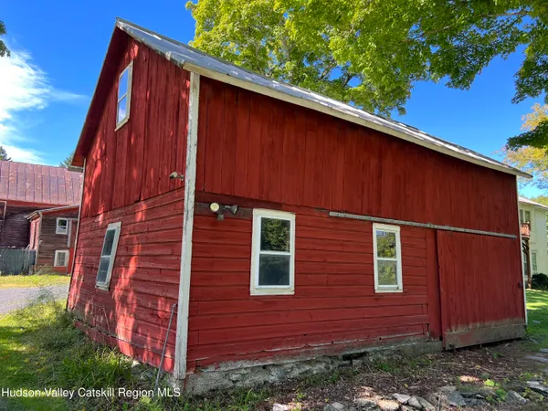 a backyard of a house with seating space