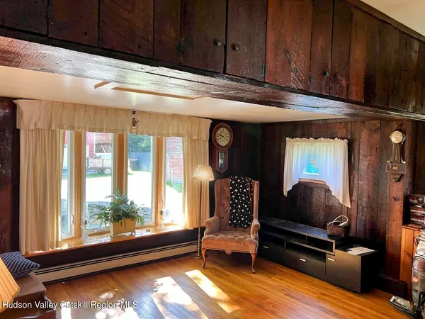 a living room with furniture and a window
