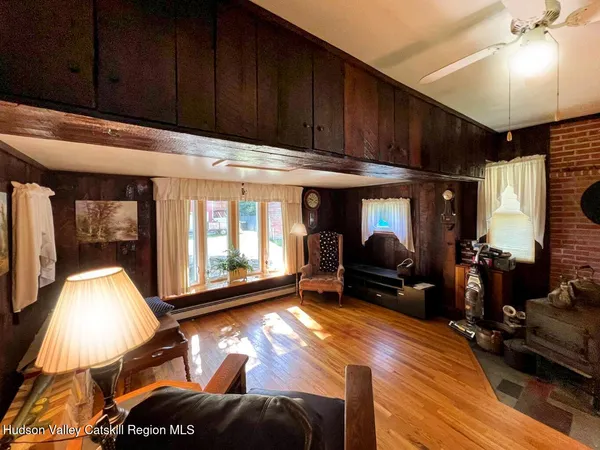 a living room with furniture fireplace and a flat screen tv