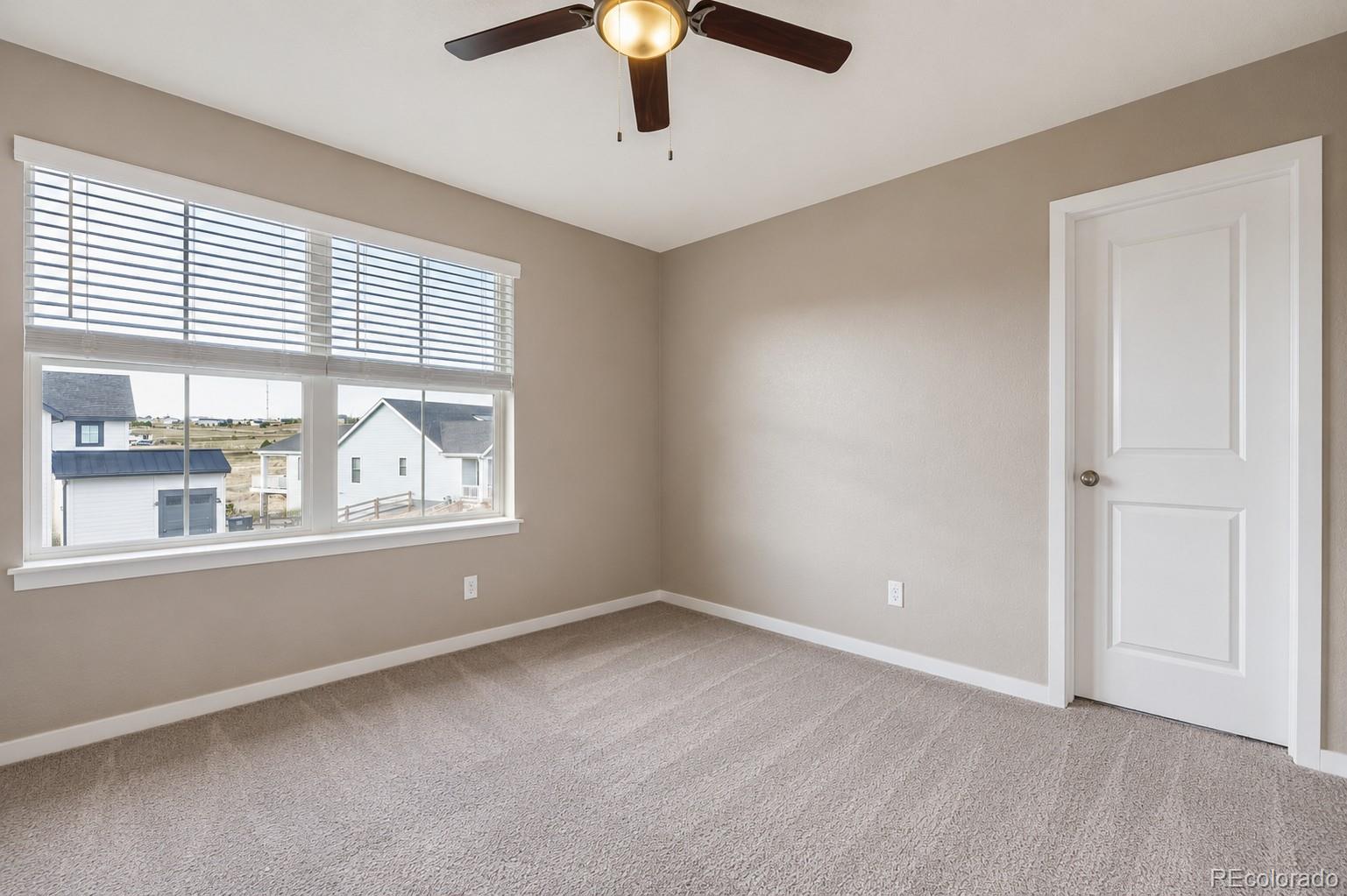 1173 Williams Loop Elizabeth, CO 80107 - Photo 17 of 30 a view of an empty room with a window
