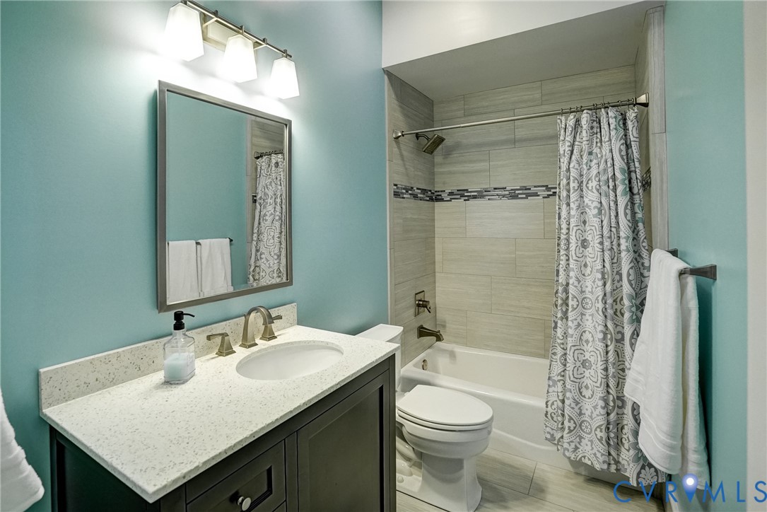 1295 Hermitage Road Manakin-Sabot, VA 23103 - Photo 55 of 55 a bathroom with a sink toilet a shower and a mirror